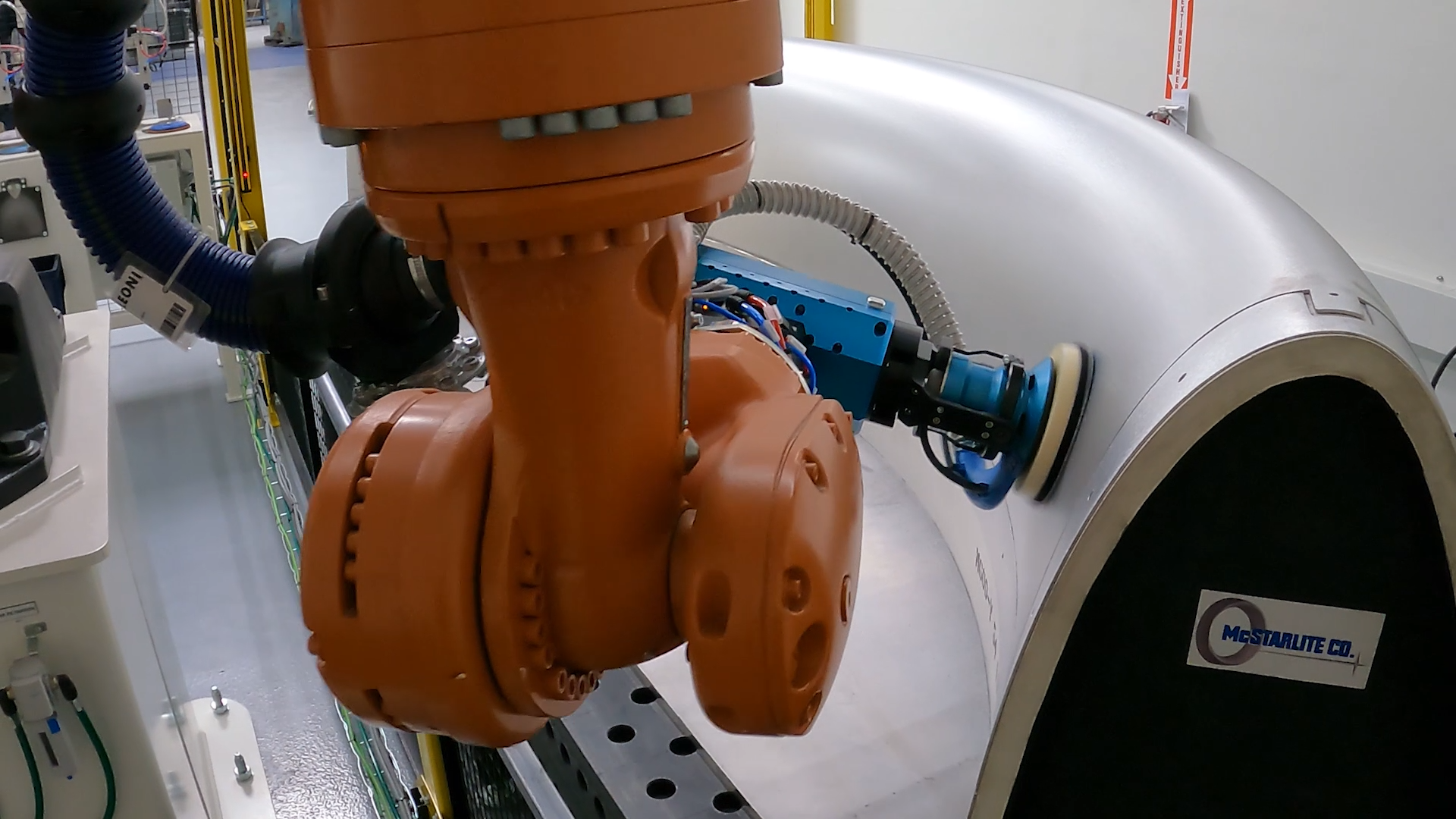 Automated robotic polishing of an aircraft engine lipskin using Robotmaster Surface Paths software for aerospace finishing.